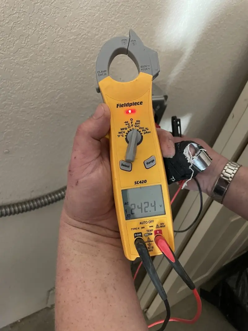 Voltage testing with clamp meter during Outlet Installation in Beacon Square